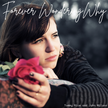 woman holding a flower dressed in black forever wondering why